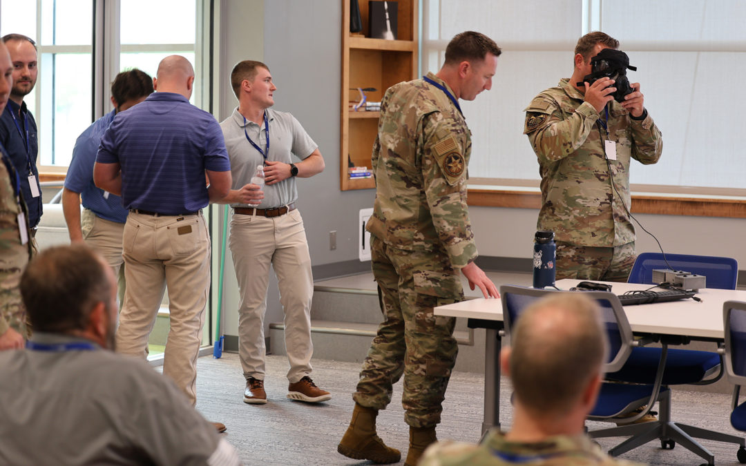 Louisiana Tech students deliver a defense innovation mask display to Airmen